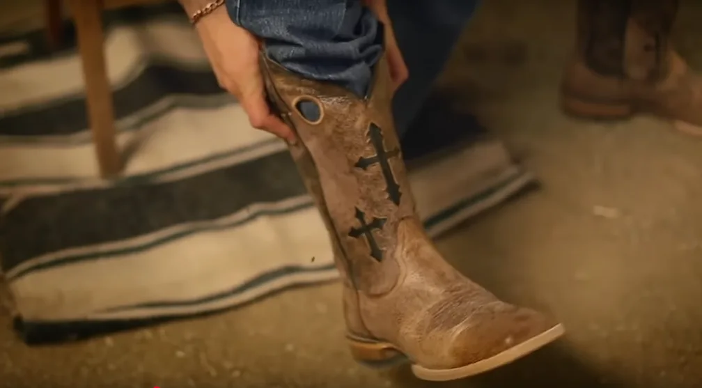 trying on cowboy boots with pull holes